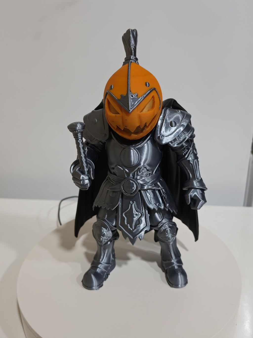 Actual 13-inch Pumpkin Knight print with orange pumpkin head, silver-toned armor and black cape — front view.